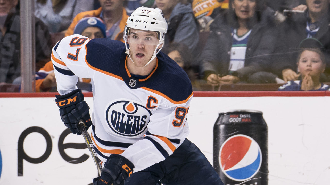 VANCOUVER, BC - MARCH 29: Connor McDavid #97 of the Edmonton Oilers skates with the puck in NHL action against the Vancouver Canucks on March, 29, 2018 at Rogers Arena in Vancouver, British Columbia, Canada.
