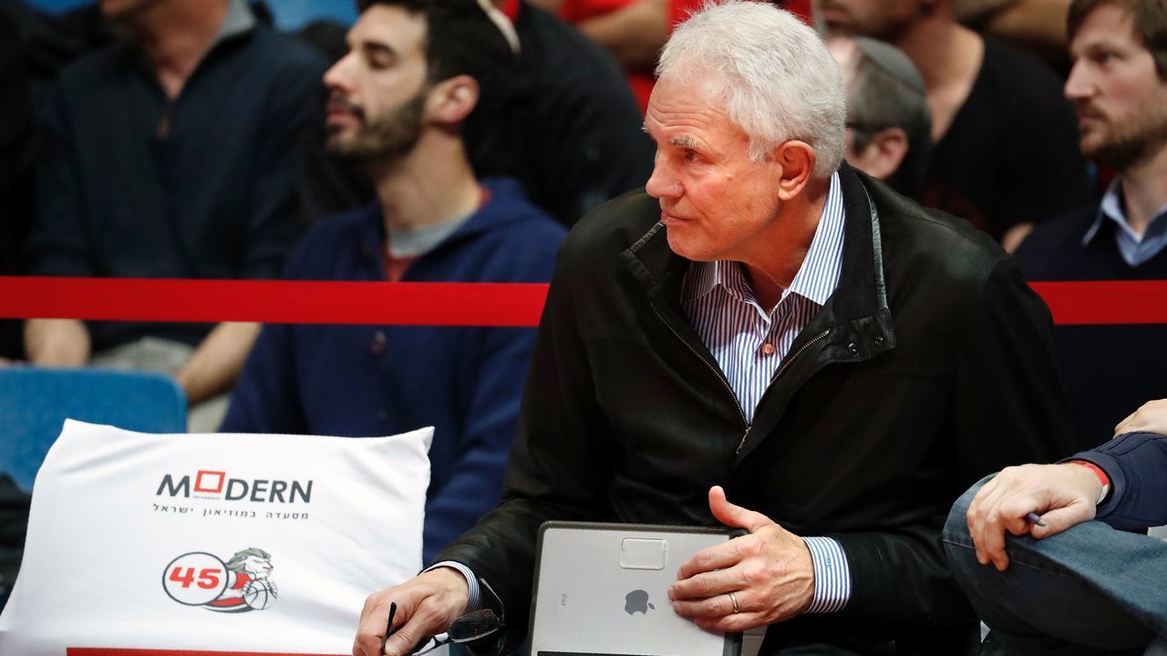 Los Angeles Lakers General Manager US Mitch Kupchak attends the Israeli Winner League match between Maccabi Tel Aviv and Hapoel Jerusalem to observe Maccabi Tel Aviv's Croatian player Dragen Bender (unseen) at the Pais Arena in Jerusalem on March 21, 2016. Dragan Bender's name is not yet well known beyond hardcore basketball fans, but that may soon change. Bender, currently playing for Israeli club Maccabi Tel Aviv, is expected to be highly sought after by US professional basketball teams in the coming months. / AFP / THOMAS COEX
