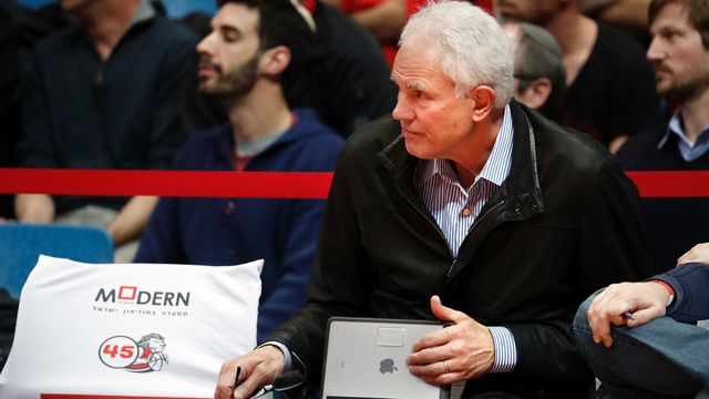 Los Angeles Lakers General Manager US Mitch Kupchak attends the Israeli Winner League match between Maccabi Tel Aviv and Hapoel Jerusalem to observe Maccabi Tel Aviv's Croatian player Dragen Bender (unseen) at the Pais Arena in Jerusalem on March 21, 2016. Dragan Bender's name is not yet well known beyond hardcore basketball fans, but that may soon change. Bender, currently playing for Israeli club Maccabi Tel Aviv, is expected to be highly sought after by US professional basketball teams in the coming months. / AFP / THOMAS COEX