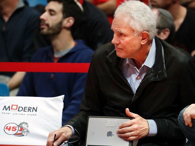 Los Angeles Lakers General Manager US Mitch Kupchak attends the Israeli Winner League match between Maccabi Tel Aviv and Hapoel Jerusalem to observe Maccabi Tel Aviv's Croatian player Dragen Bender (unseen) at the Pais Arena in Jerusalem on March 21, 2016. Dragan Bender's name is not yet well known beyond hardcore basketball fans, but that may soon change. Bender, currently playing for Israeli club Maccabi Tel Aviv, is expected to be highly sought after by US professional basketball teams in the coming months. / AFP / THOMAS COEX