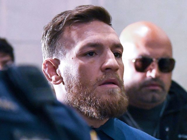 Irish Mixed Martial Arts fighter Conor McGregor leaves the Kings County (Brooklyn) Criminal Court on April 6, 2018 in New York. Irish Mixed Martial Arts fighter Conor McGregor was charged with assault and criminal mischief by New York police on April 6, 2018 and was due to appear in court. The 29-year-old superstar reportedly surrendered at a Brooklyn police station late Thursday after allegedly attacking a shuttle bus loaded with fellow mixed martial arts fighters attending a New York media event at the Barclays Center stadium.Video footage showed McGregor hurling a dolly through a side window of the bus as it moved slowly in a parking lot at the stadium in Brooklyn. / AFP PHOTO / ANGELA WEISS
