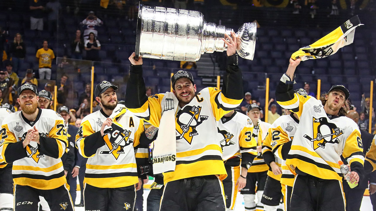 NASHVILLE, TN - JUNE 11: Sidney Crosby #87 of the Pittsburgh Penguins and his teammates celebrate with the Stanley Cup trophy after defeating the Nashville Predators 2-0 in Game Six of the 2017 NHL Stanley Cup Final at the Bridgestone Arena on June 11, 2017 in Nashville, Tennessee.