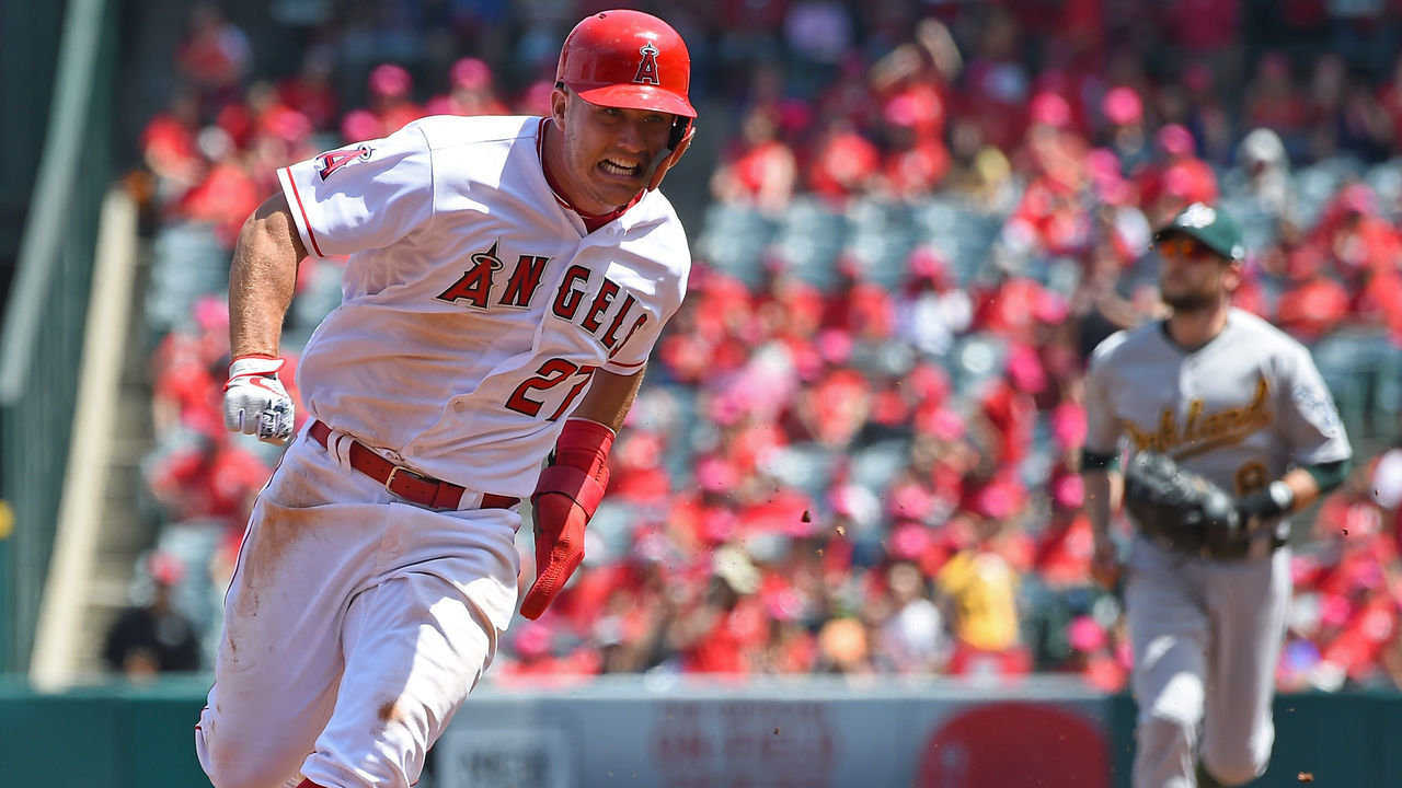 ANAHEIM, CA - APRIL 08: Mike Trout #27 of the Los Angeles Angels rounds third on his way to score a run on a double by Albert Pujols #5 of the Los Angeles Angels in the first inning of the game against the Oakland Athletics at Angel Stadium of Anaheim on April 8, 2018 in Anaheim, California.