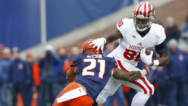 CHAMPAIGN, IL - NOVEMBER 11: Ian Thomas #80 of the Indiana Hoosiers runs the ball after a catch as Patrick Nelson #21 of the Illinois Fighting Illini attempts the tackle\ at Memorial Stadium on November 11, 2017 in Champaign, Illinois.