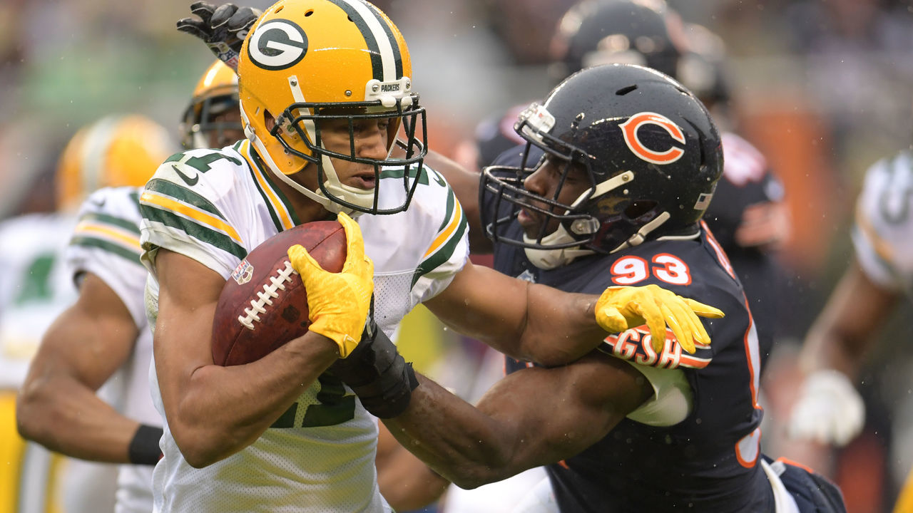 CHICAGO, IL - NOVEMBER 12: Trevor Davis #11 of the Green Bay Packers carries the football against Sam Acho #93 of the Chicago Bears in the second quarter at Soldier Field on November 12, 2017 in Chicago, Illinois.