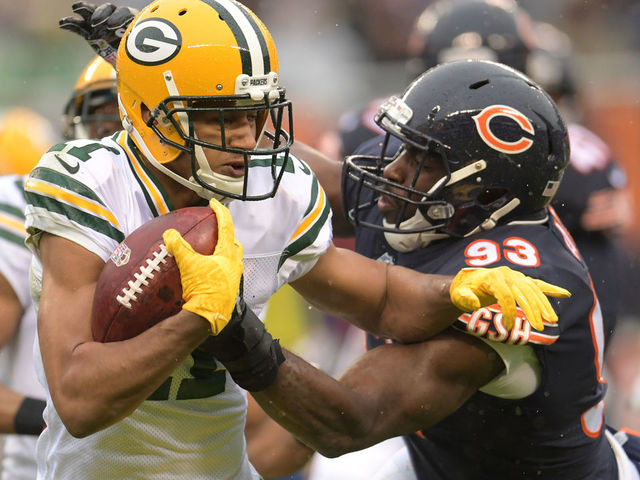 CHICAGO, IL - NOVEMBER 12: Trevor Davis #11 of the Green Bay Packers carries the football against Sam Acho #93 of the Chicago Bears in the second quarter at Soldier Field on November 12, 2017 in Chicago, Illinois.