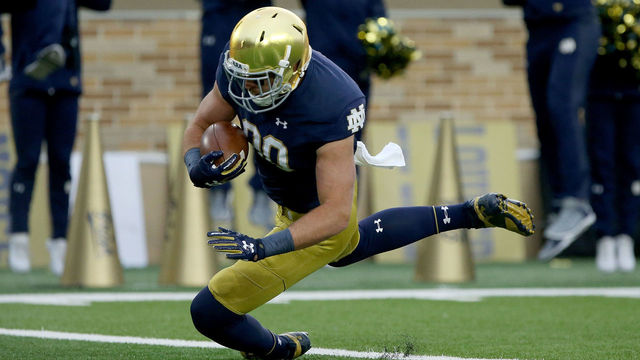SOUTH BEND, IN - OCTOBER 28: Durham Smythe #80 of the Notre Dame Fighting Irish scores a touchdown in the first quarter against the North Carolina State Wolfpack at Notre Dame Stadium on October 28, 2017 in South Bend, Indiana.