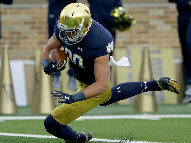 SOUTH BEND, IN - OCTOBER 28: Durham Smythe #80 of the Notre Dame Fighting Irish scores a touchdown in the first quarter against the North Carolina State Wolfpack at Notre Dame Stadium on October 28, 2017 in South Bend, Indiana.