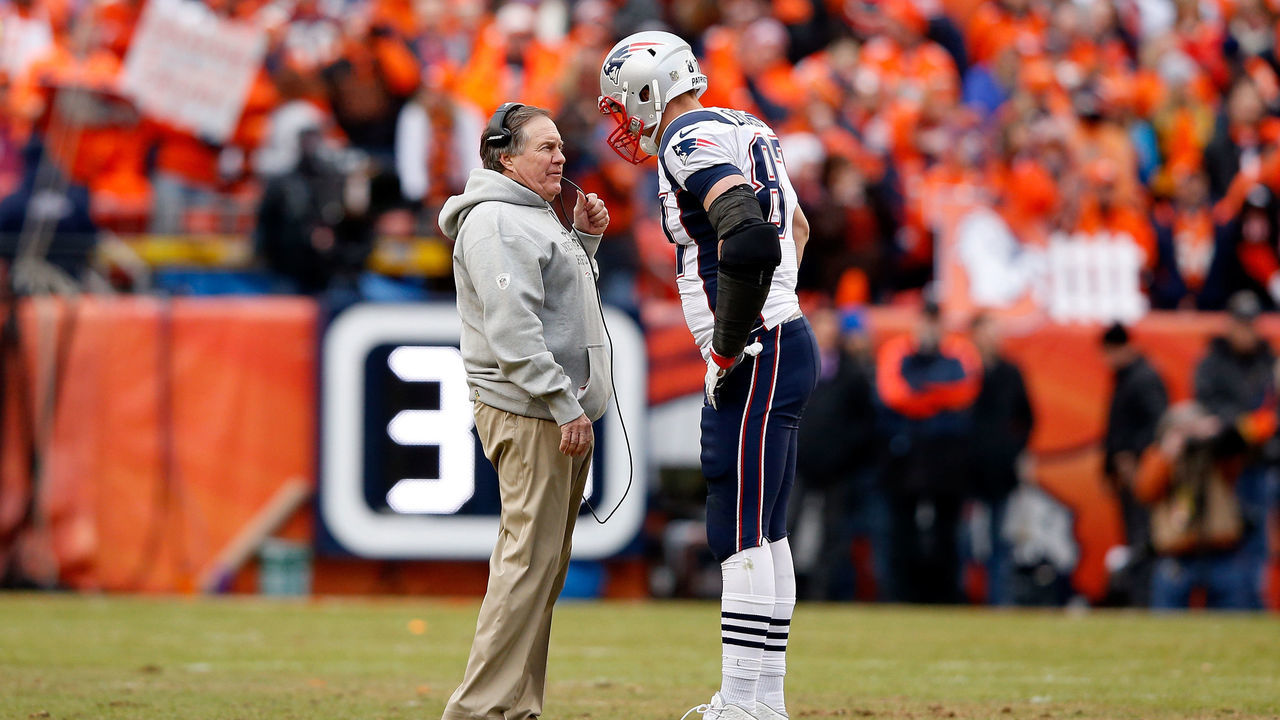 DENVER, CO - JANUARY 24: Head coach Bill Belichick of the New England Patriots speaks to Rob Gronkowski #87 in the fourth quarter against the Denver Broncos in the AFC Championship game at Sports Authority Field at Mile High on January 24, 2016 in Denver, Colorado.
