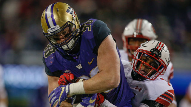 SEATTLE, WA - NOVEMBER 18: Tight end Will Dissly #98 of the Washington Huskies rushes for a first down to the two yard line in the fourth quarter against defensive back Jaylon Johnson #7 of the Utah Utes at Husky Stadium on November 18, 2017 in Seattle, Washington.
