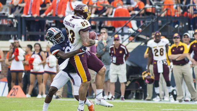 CHARLOTTESVILLE, VA - SEPTEMBER 24: Kareem Gibson #31 of the Virginia Cavaliers brings down Tyler Conklin #83 of the Central Michigan Chippewas during their game at Scott Stadium on September 24, 2016 in Charlottesville, Virginia. Virginia beat Central Michigan 49-35.