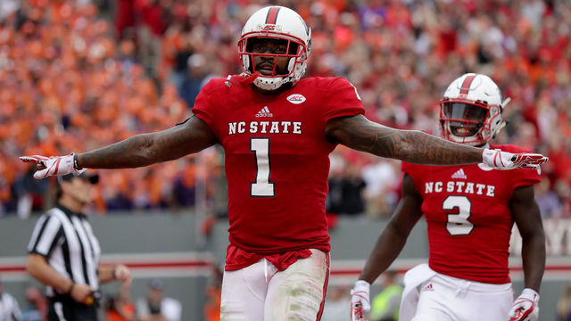 RALEIGH, NC - NOVEMBER 04: Jaylen Samuels #1 of the North Carolina State Wolfpack reacts after scoring a touchdown against the Clemson Tigers during their game at Carter Finley Stadium on November 4, 2017 in Raleigh, North Carolina.