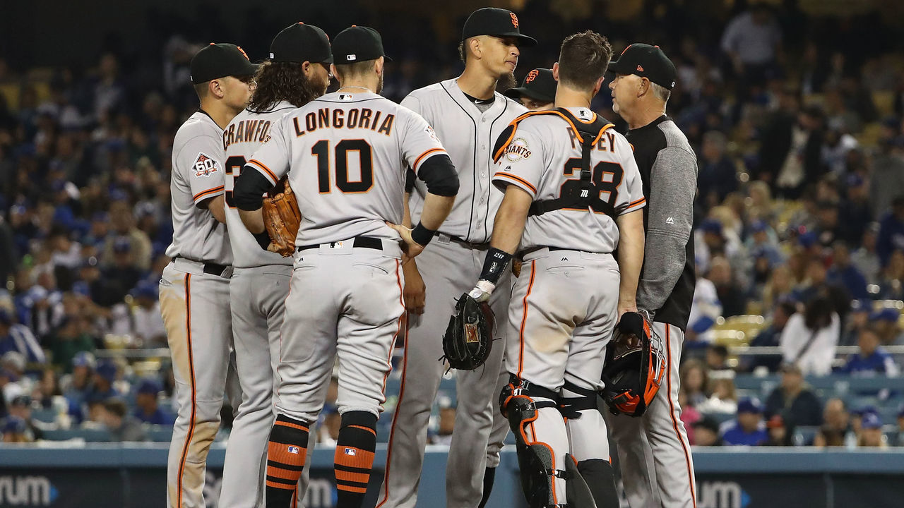 LOS ANGELES, CA - APRIL 01: Pitching coach Curt Young #43 of the San Francisco Giants, right, visits the mound to talk to pitcher Roberto Gomez #67 in the eighth inning during the MLB game against the Los Angeles Dodgers at Dodger Stadium on April 1, 2018 in Los Angeles, California. The Dodgers defeated the Giants 9-0.