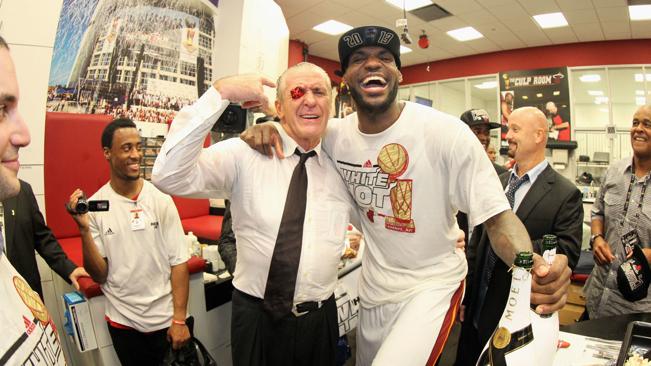 MIAMI, FL - JUNE 20: President of the Miami Heat Pat Riley celebrates with LeBron James #6 of the Miami Heat and his good luck Nike sneaker eyelet after defeating the San Antonio Spurs in Game Seven of the 2013 NBA Finals on June 20, 2013 at American Airlines Arena in Miami, Florida. Mandatory Copyright Notice: Copyright 2013 NBAE