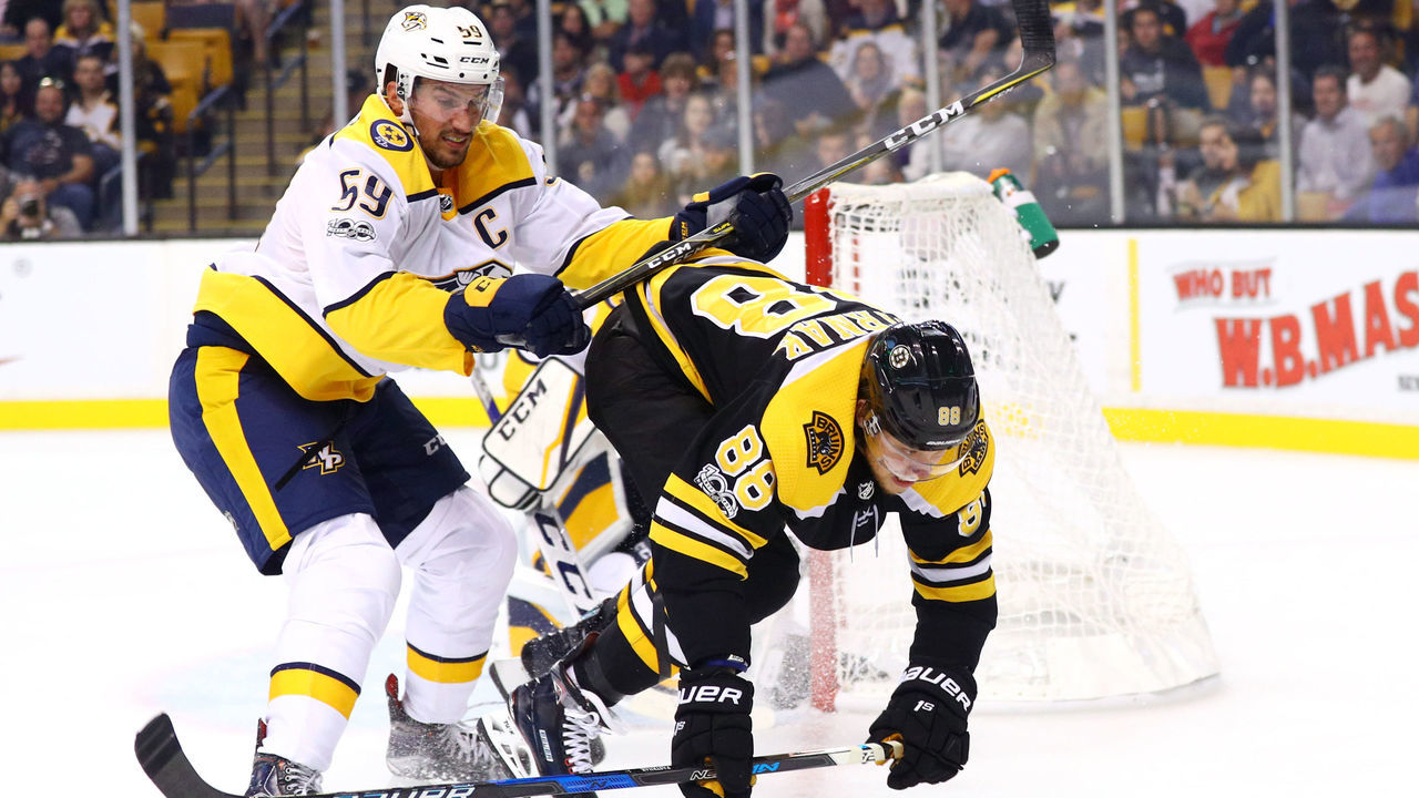 BOSTON, MA - OCTOBER 5: Roman Josi #59 of the Nashville Predators checks David Pastrnak #88 of the Boston Bruins during the third period at TD Garden on October 5, 2017 in Boston, Massachusetts. The Bruins defeat the Predators 4-3.