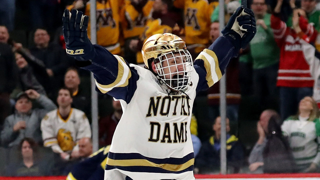 ST PAUL, MN - APRIL 05: Jake Evans #18 of the Notre Dame Fighting Irish celebrates his game winning goal in the final seconds of the game against the Michigan Wolverines during the semifinals of the 2018 NCAA Division I Men's Hockey Championships on April 5, 2018 at Xcel Energy Center in St Paul, Minnesota.The Notre Dame Fighting Irish defeated the Michigan Wolverines 4-3 to advance to the championship game.