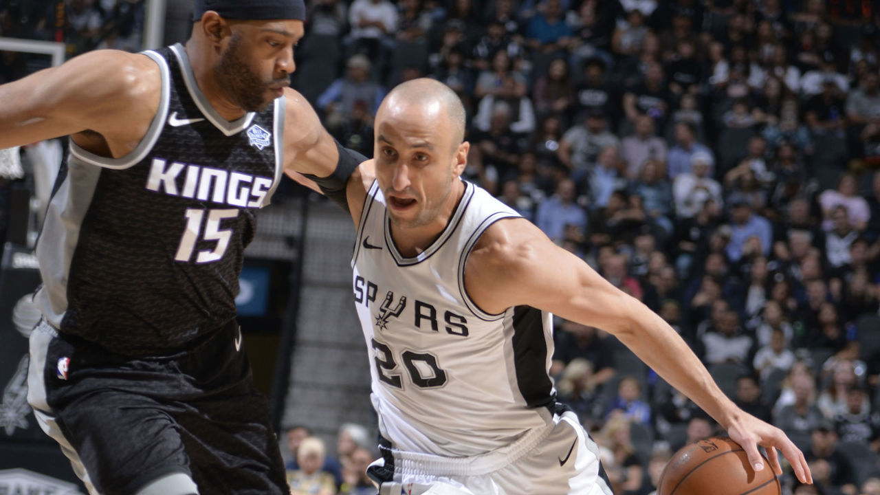 SAN ANTONIO, TX - APRIL 9: Manu Ginobili #20 of the San Antonio Spurs handles the ball against Vince Carter #15 of the Sacramento Kings on April 9, 2018 at the AT&T Center in San Antonio, Texas. Mandatory Copyright Notice: Copyright 2018 NBAE (Photos by Mark Sobhani/NBAE via Getty Images)