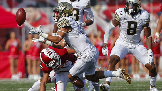 BLOOMINGTON, IN - SEPTEMBER 24: Jessie Bates #3 of the Wake Forest Demon Deacons reaches for and makes the interception against the Indiana Hoosiers at Memorial Stadium on September 24, 2016 in Bloomington, Indiana.