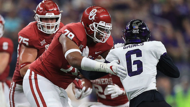 ARLINGTON, TX - DECEMBER 02: Orlando Brown #78 of the Oklahoma Sooners blocks Innis Gaines #6 of the TCU Horned Frogs in the third quarter during Big 12 Championship at AT&T Stadium on December 2, 2017 in Arlington, Texas.