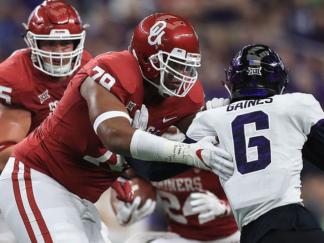 ARLINGTON, TX - DECEMBER 02: Orlando Brown #78 of the Oklahoma Sooners blocks Innis Gaines #6 of the TCU Horned Frogs in the third quarter during Big 12 Championship at AT&T Stadium on December 2, 2017 in Arlington, Texas.