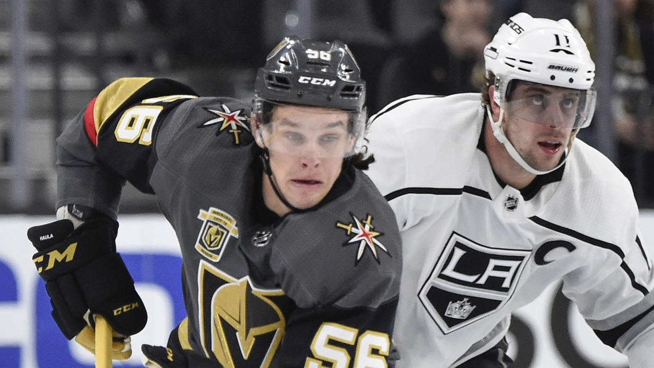 LAS VEGAS, NV - FEBRUARY 27: Erik Haula #56 of the Vegas Golden Knights skates with the puck while Anze Kopitar #11 of the Los Angeles Kings defends during the game at T-Mobile Arena on February 27, 2018 in Las Vegas, Nevada.