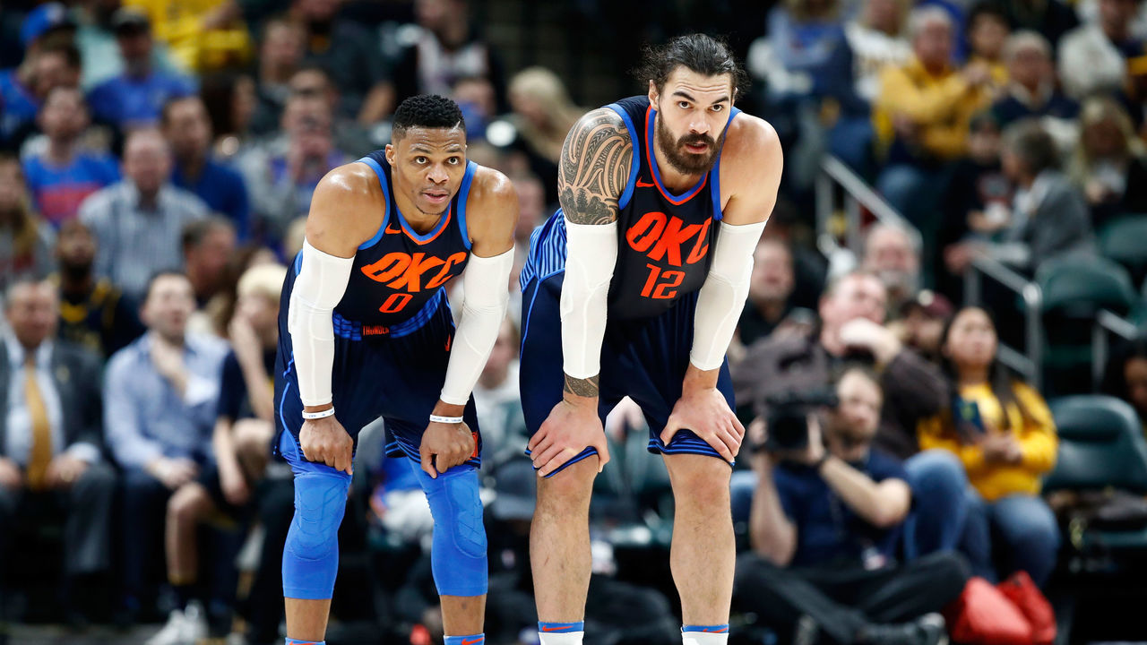 INDIANAPOLIS, IN - DECEMBER 13: Russell Westbrook #0 and Steven Adams #12 of the Oklahoma City Thunder watch the action against the Indiana Pacers at Bankers Life Fieldhouse on December 13, 2017 in Indianapolis, Indiana.