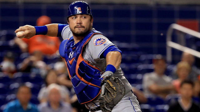 MIAMI, FL - SEPTEMBER 18: Travis d'Arnaud #18 of the New York Mets makes a throw to first during a game against the Miami Marlins at Marlins Park on September 18, 2017 in Miami, Florida.
