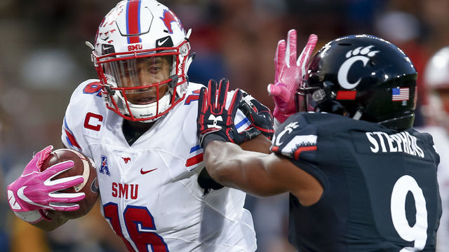 CINCINNATI, OH - OCTOBER 21: Courtland Sutton #16 of the Southern Methodist Mustang throws the stiff arm at Linden Stephens #9 of the Cincinnati Bearcats as he runs for a touchdown at Nippert Stadium on October 21, 2017 in Cincinnati, Ohio.
