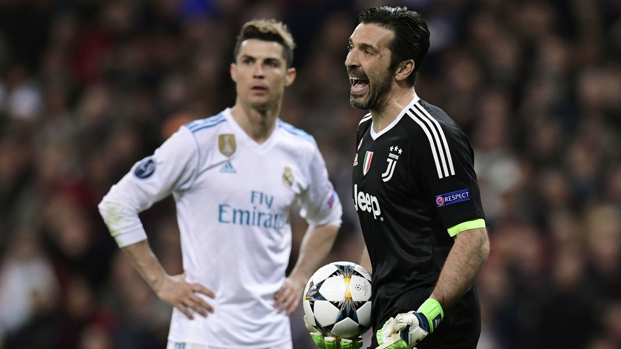 Juventus' Italian goalkeeper Gianluigi Buffon (R) reacts next to Real Madrid's Portuguese forward Cristiano Ronaldo during the UEFA Champions League quarter-final second leg football match between Real Madrid CF and Juventus FC at the Santiago Bernabeu stadium in Madrid on April 11, 2018. / AFP PHOTO / JAVIER SORIANO
