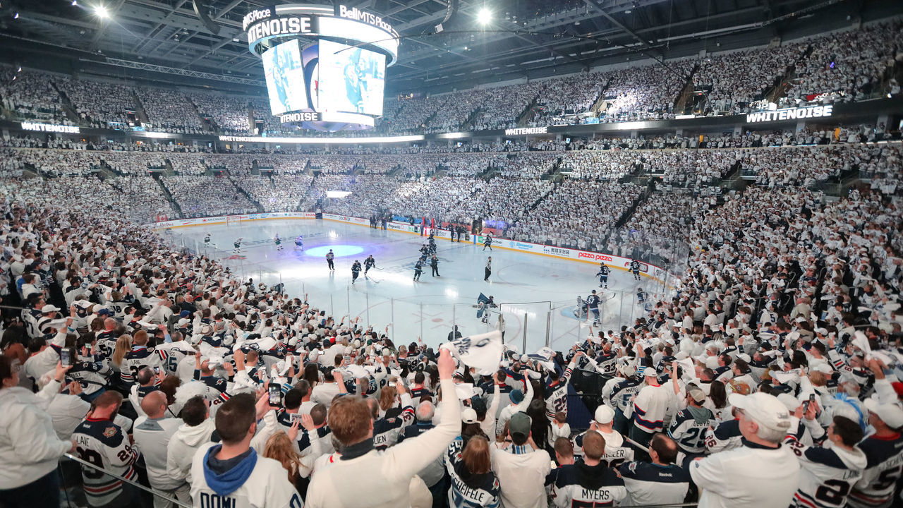 WINNIPEG, MANITOBA - APRIL 11: Fans of the Winnipeg Jets welcome their team to the ice as they took on the Minnesota Wild in Game One of the Western Conference First Round during the 2018 NHL Stanley Cup Playoffs on April 11, 2018 at Bell MTS Place in Winnipeg, Manitoba, Canada.