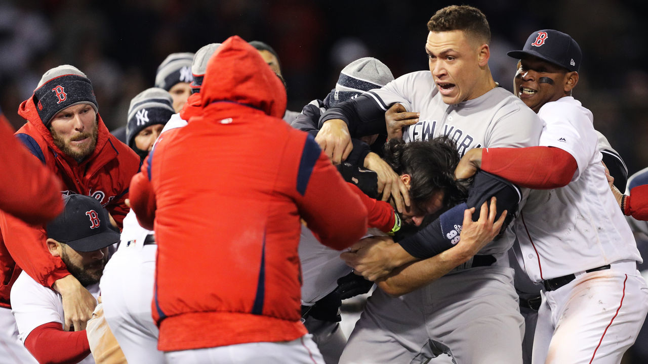 BOSTON, MA - APRIL 11: From left, Chris Sale #41 of the Boston Red Sox, Aaron Judge #99 of the New York Yankees and Rafael Devers #11 work to separate a fight involving Joe Kelly #56 of the Boston Red Sox and Tyler Austin #26 of the New York Yankees during the seventh inning at Fenway Park on April 11, 2018 in Boston, Massachusetts. Austin rushed the mound after being struck by a pitch thrown by Kelly.