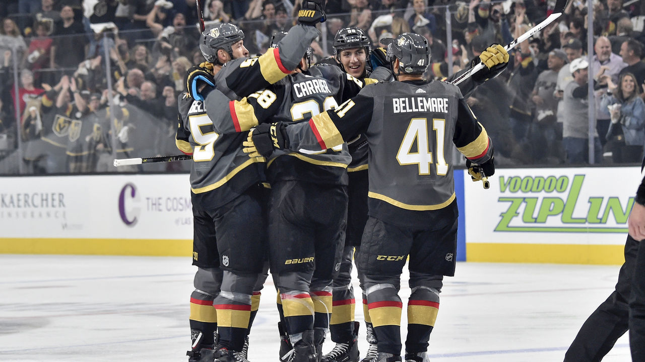 LAS VEGAS, NV - APRIL 11: Deryk Engelland #5, William Carrier #28, Tomas Nosek #92, and Pierre-Edouard Bellemare #41 celebrate a goal scored by their teammate Shea Theodore #27 of the Vegas Golden Knights against the Los Angeles Kings in Game One of the Western Conference First Round during the 2018 NHL Stanley Cup Playoffs at T-Mobile Arena on April 11, 2018 in Las Vegas, Nevada.