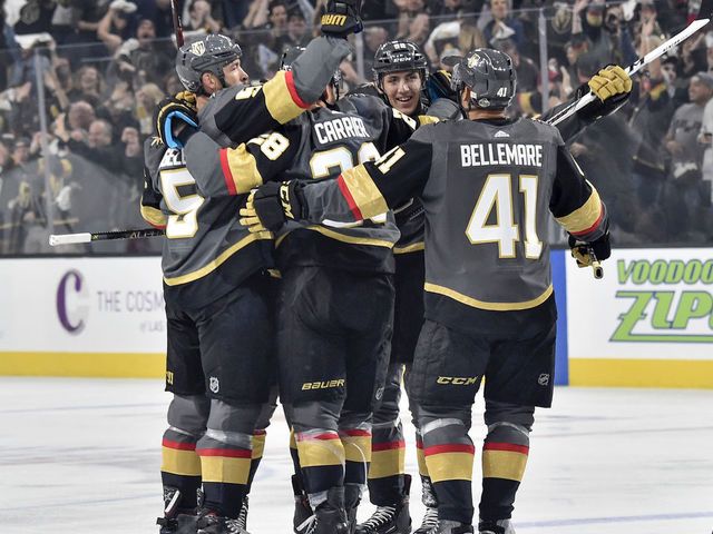 LAS VEGAS, NV - APRIL 11: Deryk Engelland #5, William Carrier #28, Tomas Nosek #92, and Pierre-Edouard Bellemare #41 celebrate a goal scored by their teammate Shea Theodore #27 of the Vegas Golden Knights against the Los Angeles Kings in Game One of the Western Conference First Round during the 2018 NHL Stanley Cup Playoffs at T-Mobile Arena on April 11, 2018 in Las Vegas, Nevada.