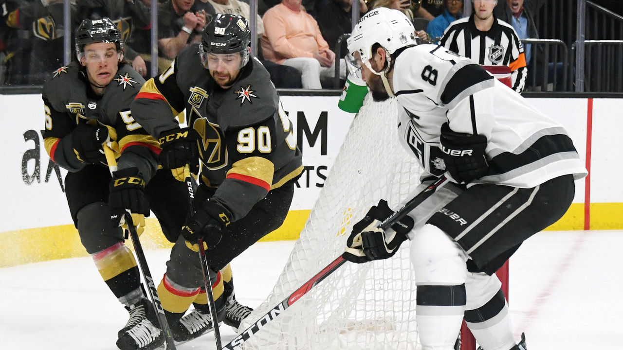 LAS VEGAS, NV - APRIL 11: (L-R) Erik Haula #56 and Tomas Tatar #90 of the Vegas Golden Knights and Drew Doughty #8 of the Los Angeles Kings fight for the puck in the second period of Game One of the Western Conference First Round at T-Mobile Arena on April 11, 2018 in Las Vegas, Nevada.