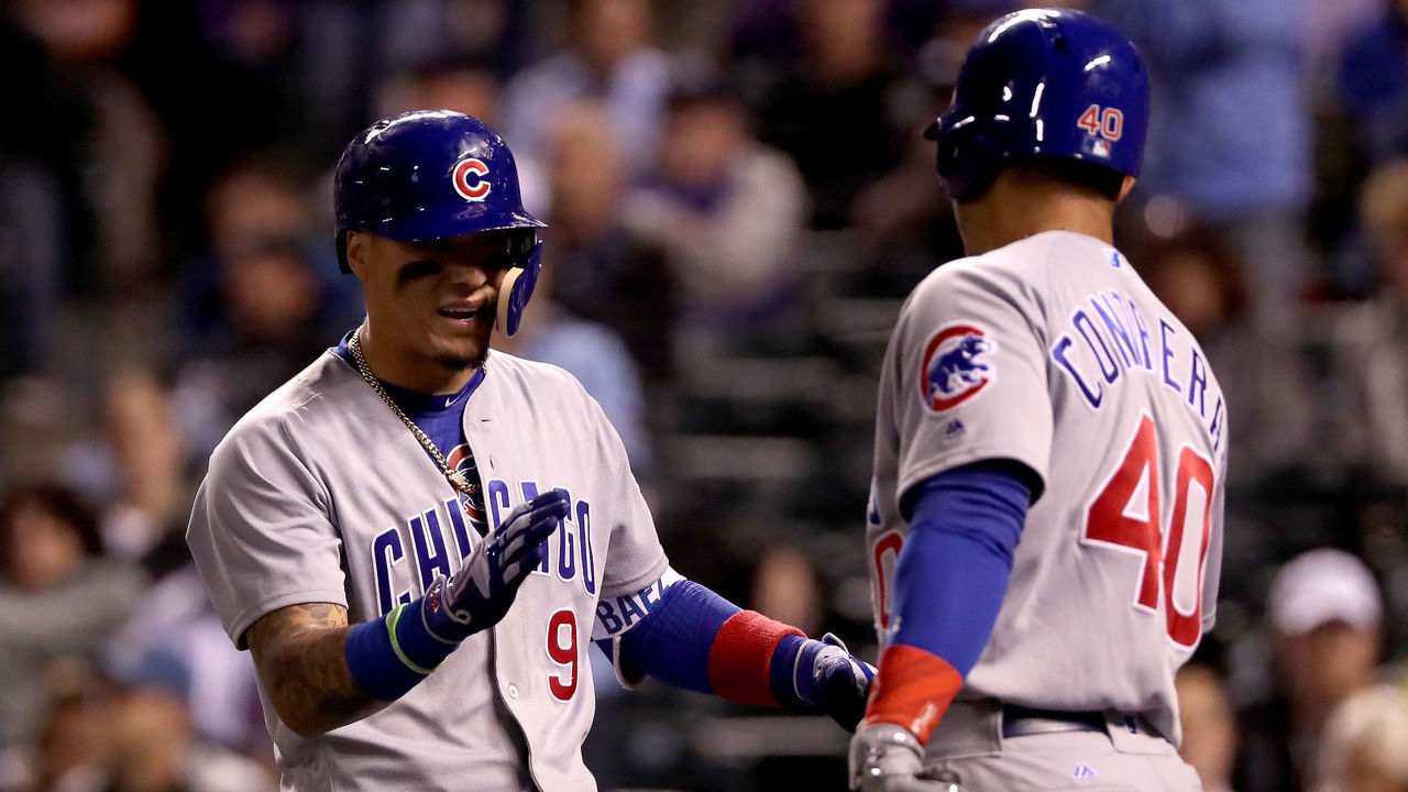 DENVER, CO - MAY 09: Javier Baez #9 of the Chicago Cubs is congratulated by Wilson Contreras #40 after hitting a 2 RBI home run in the eighth inning against the Colorado Rockies during the second game of a double header at Coors Field on May 9, 2017 in Denver, Colorado.