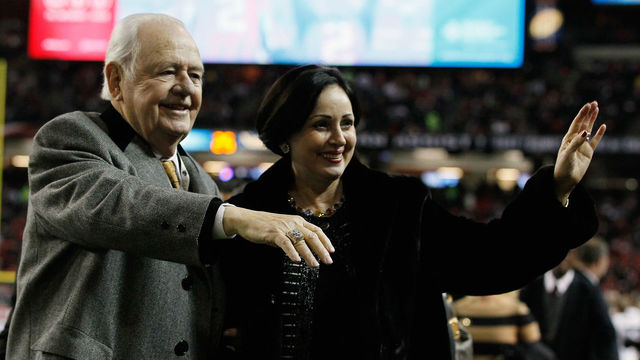 ATLANTA, GA - DECEMBER 27: New Orleans Saints owner Tom Benson and his wife Gayle walk off the field during warm-ups prior to the start of the game against the Atlanta Falcons at the Georgia Dome on December 27, 2010 in Atlanta, Georgia.