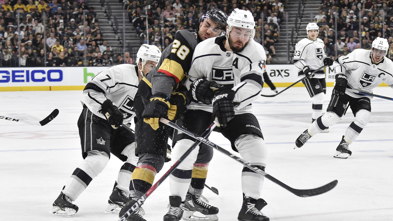 LAS VEGAS, NV - APRIL 11: Drew Doughty #8 of the Los Angeles Kings collides with William Carrier #28 of the Vegas Golden Knights in Game One of the Western Conference First Round during the 2018 NHL Stanley Cup Playoffs at T-Mobile Arena on April 11, 2018 in Las Vegas, Nevada.
