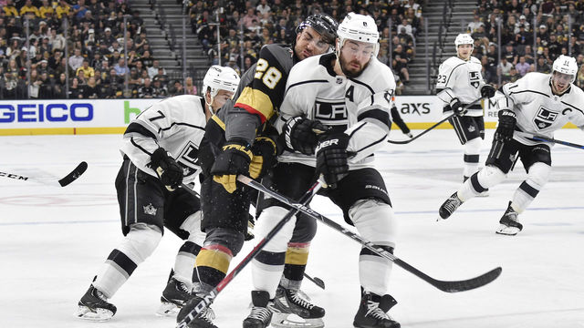 LAS VEGAS, NV - APRIL 11: Drew Doughty #8 of the Los Angeles Kings collides with William Carrier #28 of the Vegas Golden Knights in Game One of the Western Conference First Round during the 2018 NHL Stanley Cup Playoffs at T-Mobile Arena on April 11, 2018 in Las Vegas, Nevada.