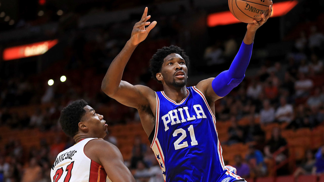 MIAMI, FL - OCTOBER 21: Joel Embiid #21 of the Philadelphia 76ers drives on Hassan Whiteside #21 of the Miami Heat during a preseason game at American Airlines Arena on October 21, 2016 in Miami, Florida.