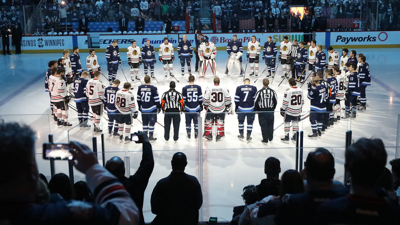 WINNIPEG, MANITOBA - APRIL 7: Winnipeg Jets and Chicago Blackhawks players honour those involved in the Humboldt Broncos bus crash tragedy before NHL action on April 7, 2018 at Bell MTS Place in Winnipeg, Manitoba.