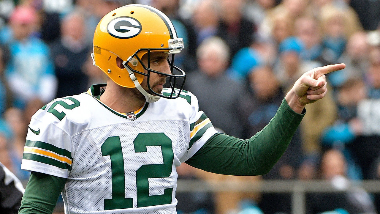 CHARLOTTE, NC - DECEMBER 17: Aaron Rodgers #12 of the Green Bay Packers reacts after a touchdown pass against the Carolina Panthers in the first quarter during their game at Bank of America Stadium on December 17, 2017 in Charlotte, North Carolina.