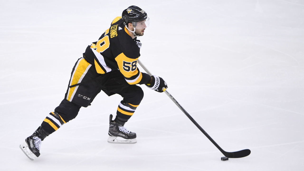 PITTSBURGH, PA - APRIL 11: Pittsburgh Penguins defenseman Kris Letang (58) skates with the puck during the third period. The Pittsburgh Penguins won Game One of the Eastern Conference First Round during the 2018 NHL Stanley Cup Playoffs in a 7-0 shutout against the Philadelphia Flyers on April 11, 2018, at PPG Paints Arena in Pittsburgh, PA.