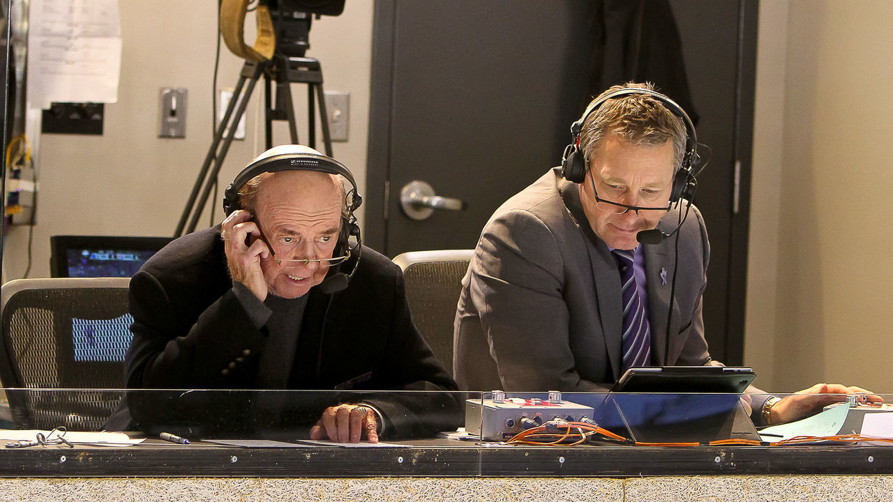 WINNIPEG, MB - JANUARY 25: Hockey Night in Canada and Hockey Hall of Fame broadcaster Bob Cole (left) calls the game with color commentator Garry Galley during second period action between the Winnipeg Jets and Toronto Maple Leafs at the MTS Centre on January 25, 2014 in Winnipeg, Manitoba, Canada. The Jets defeated the Leafs 5-4 in overtime.