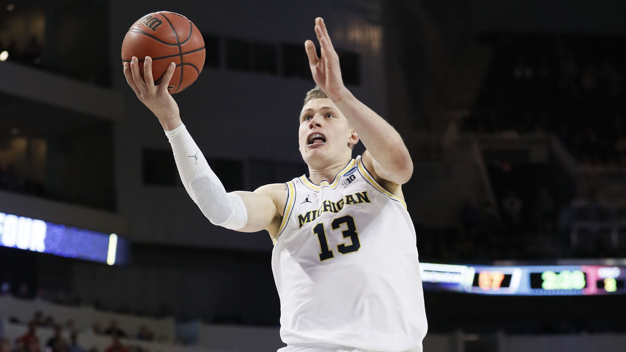WICHITA, KS - MARCH 17: Moe Wagner #13 of the Michigan Wolverines lays up a shot against the Houston Cougars in the second round of the 2018 NCAA Men's Basketball Tournament held at INTRUST Arena on March 17, 2018 in Wichita, Kansas.