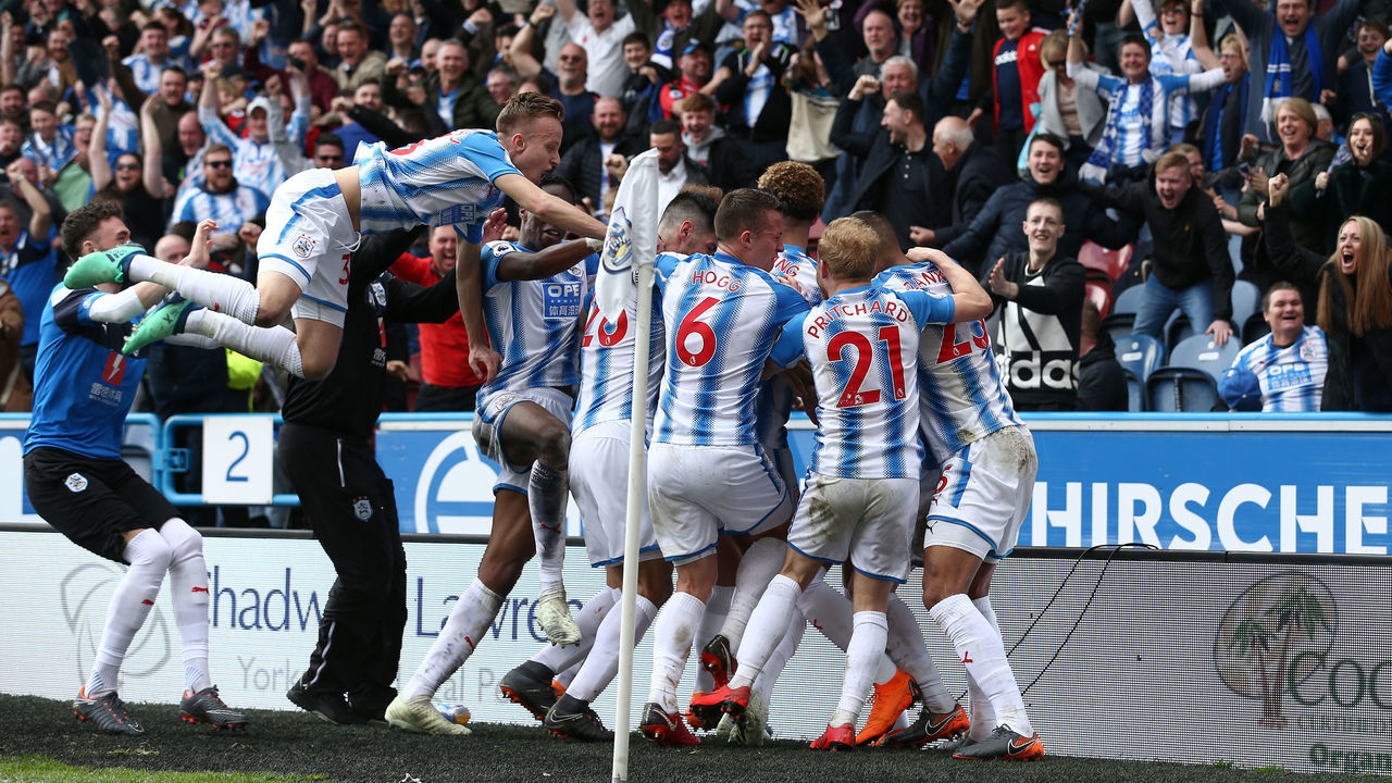 HUDDERSFIELD, ENGLAND - APRIL 14: Tom Ince of Huddersfield Town celebrates with teammates after scoring his sides first goal during the Premier League match between Huddersfield Town and Watford at John Smith's Stadium on April 14, 2018 in Huddersfield, England.