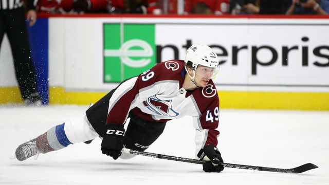 CHICAGO, IL - MARCH 20: Samuel Girard #49 of the Colorado Avalanche hits the ice after shooting against the Chicago Blackhawks at the United Center on March 20, 2018 in Chicago, Illinois.