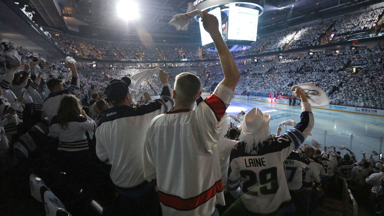 WINNIPEG, MANITOBA - APRIL 13: Fans of the Winnipeg Jets cheer their team against the Minnesota Wild in Game Two of the Western Conference First Round during the 2018 NHL Stanley Cup Playoffs on April 13, 2018 at Bell MTS Place in Winnipeg, Manitoba, Canada. *** Local Caption ***