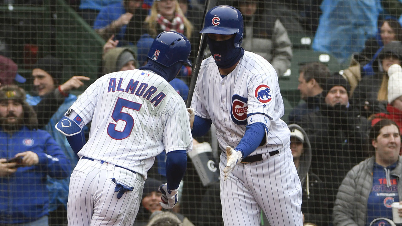 CHICAGO, IL - APRIL 14: Albert Almora Jr. #5 of the Chicago Cubs is greeted by Kris Bryant #17 of the Chicago Cubs after hitting a home run against the Atlanta Braves during the first inning on April 14, 2018 at Wrigley Field in Chicago, Illinois.