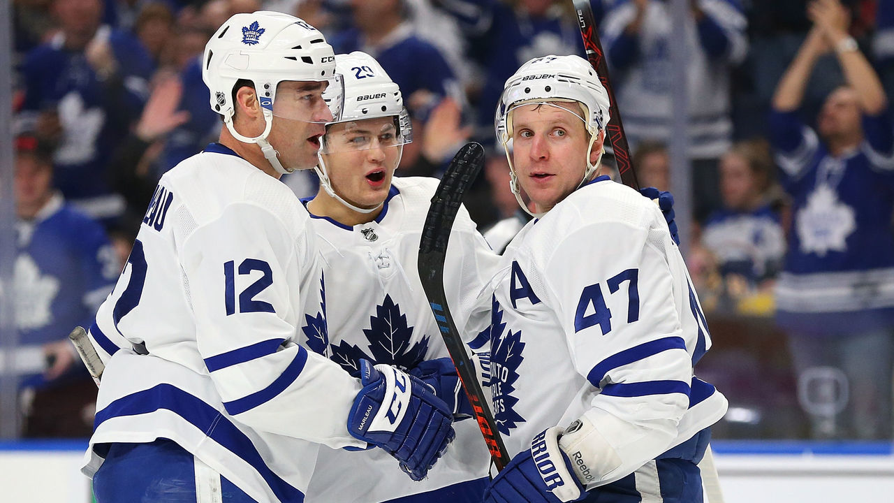 BUFFALO, NY - MARCH 5: Leo Komarov #47 of the Toronto Maple Leafs celebrates his goal against the Buffalo Sabres with Patrick Marleau #12 and William Nylander #29 during the first period at KeyBank Center on March 5, 2018 in Buffalo, New York.