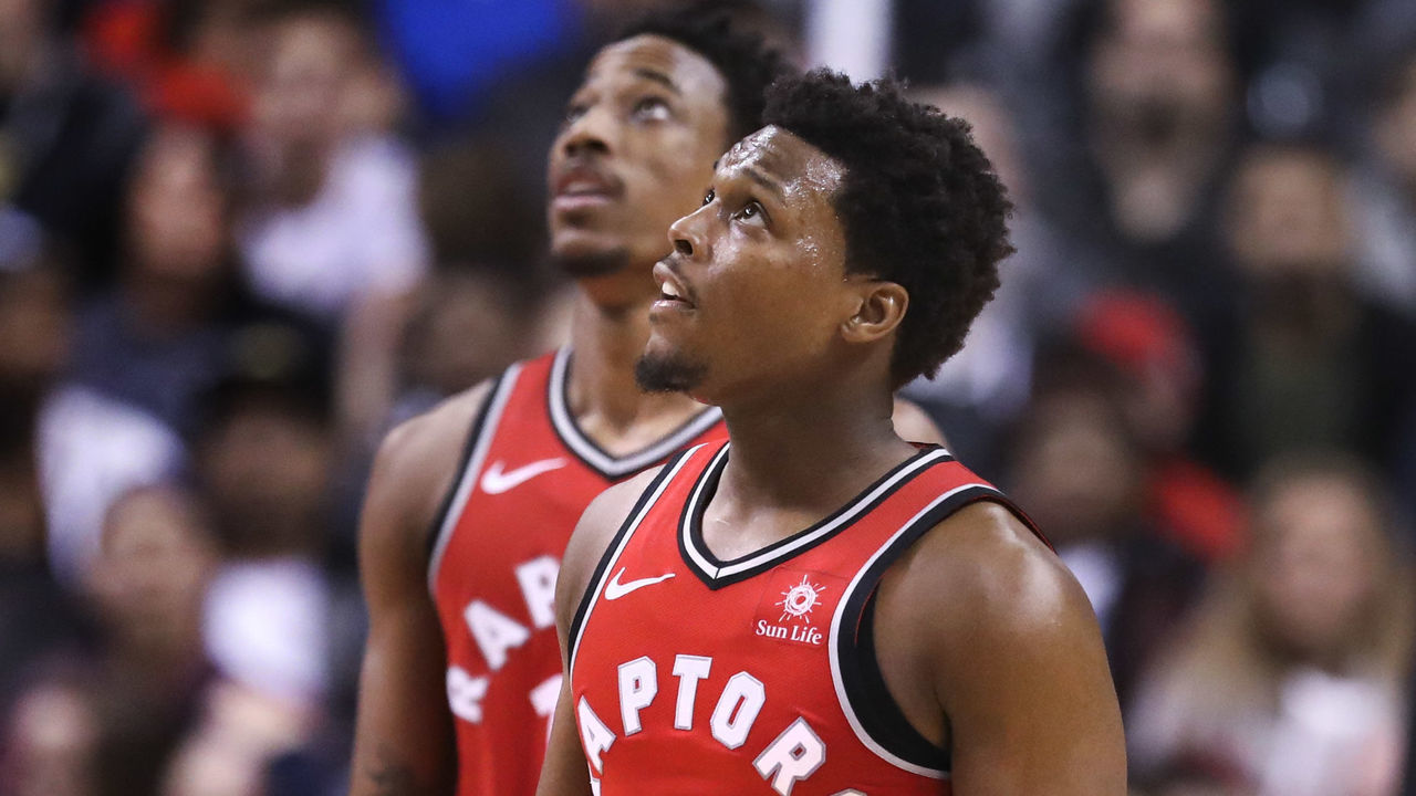 TORONTO, ON - March 25 In second half action, both Toronto Raptors guard Kyle Lowry (7) and DeMar DeRozan look up to the scoreboard to watch a replay of a foul. The Toronto Raptors lost to the LA Clippers 117-106 in NBA basketball action at the Air Canada Centre (ACC) in Toronto. {man} 25, 2018 (Richard Lautens/Toronto Star via Getty Images)